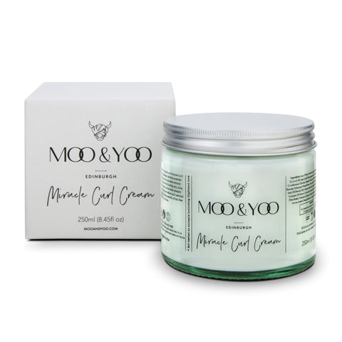 A jar of Miracle Curl Cream by MOO & YOO, with the product visible in front of its packaging box.