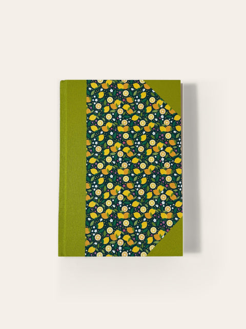 Hand-bound A5 notebook with lime green cloth and lemon print paper cover, ruled pages, Sisu Stationery
