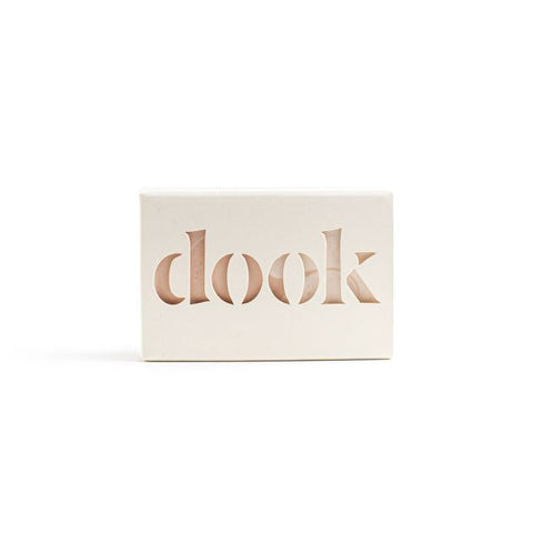 A soap bar in a box presenting packaging with logo. 