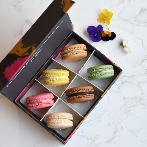 Luxury French macarons in classic flavours in a gift box, available online for delivery.