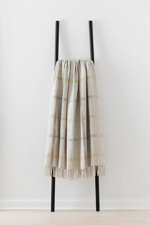 Maree Feather merino lambswool blanket in cream and soft turquoise, made in Scotland