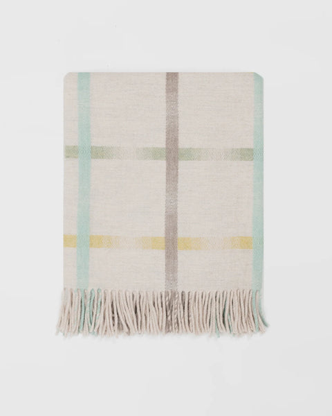 Maree Feather merino lambswool blanket in cream and soft turquoise, made in Scotland