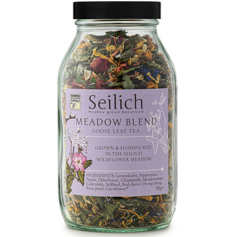 Glass jar of Seilich Meadow Blend loose leaf tea on a white background