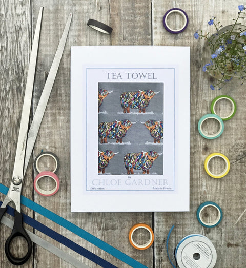 A GIFT BOXED TEA TOWEL - Bright Highland Cow on Grey Repeat - Chloe Gardner - Made Scotland