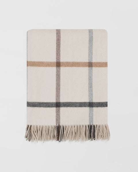 Milton merino lambswool blanket in Pebble, a cream windowpane check, folded